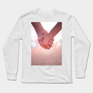 Close up of young female and male hands holding. Long Sleeve T-Shirt